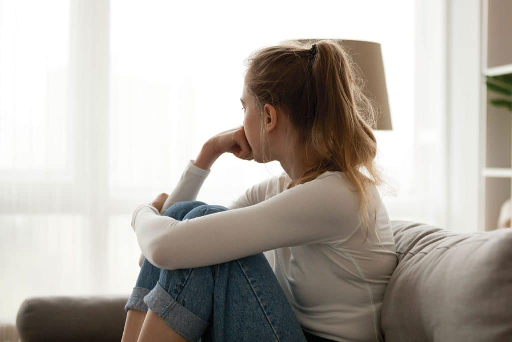 An image of a woman looking contemplative.