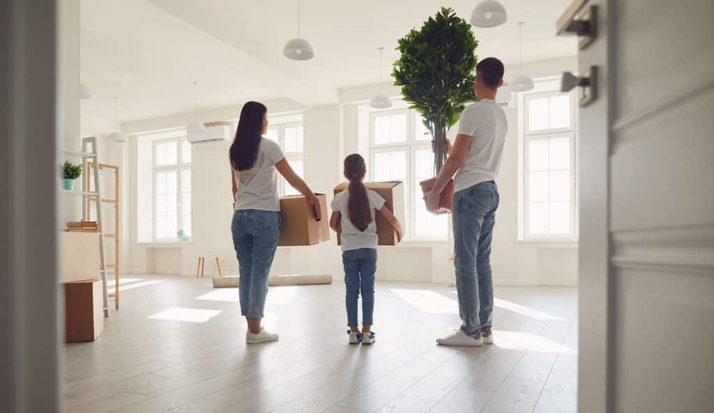 An image of a family holiday packing boxes and possessions from their home.