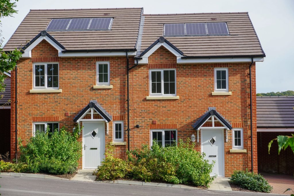 An image of two brick built family homes.